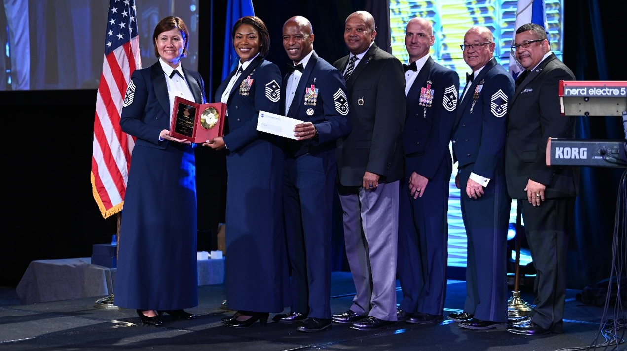 SAN ANTONIO, Texas &ndash; Master Sgt. Crystal Bateman, second from left, 402nd Aircraft Maintenance Group first sergeant, receives the 2021 U.S. Air Force First Sergeant of the Year award from Chief Master Sergeant of the Air Force Joanne Bass, left, at San Antonio Texas, Aug. 27, 2022. A first sergeant is a key leader serving who is the dedicated focal point for all readiness, health, morale, welfare, and quality-of-life issues within their organizations.