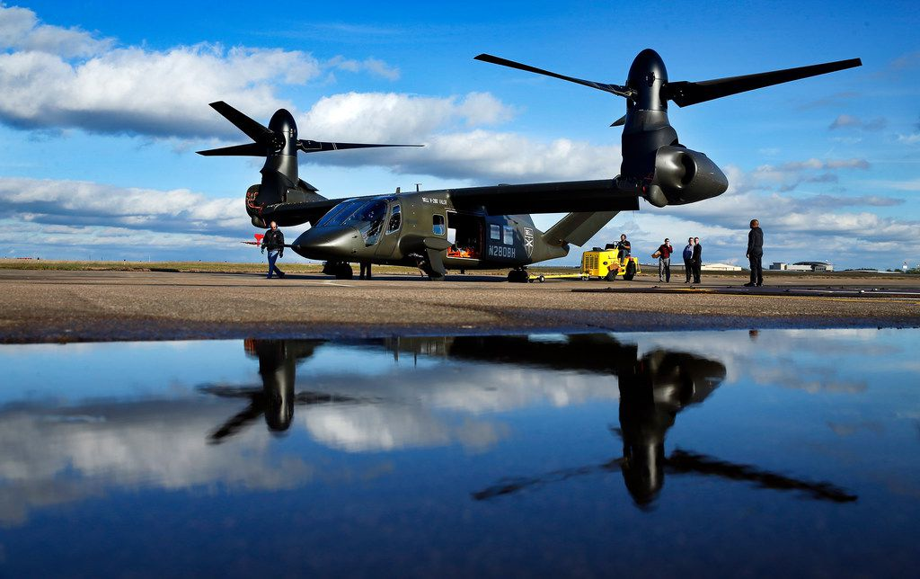 The V-280 Valor tilt-rotor, a next-generation aircraft that Bell wants to build for the U.S. military, was reflected in rain water after demonstrating its skills at the Bell Flight Research Center in Arlington.