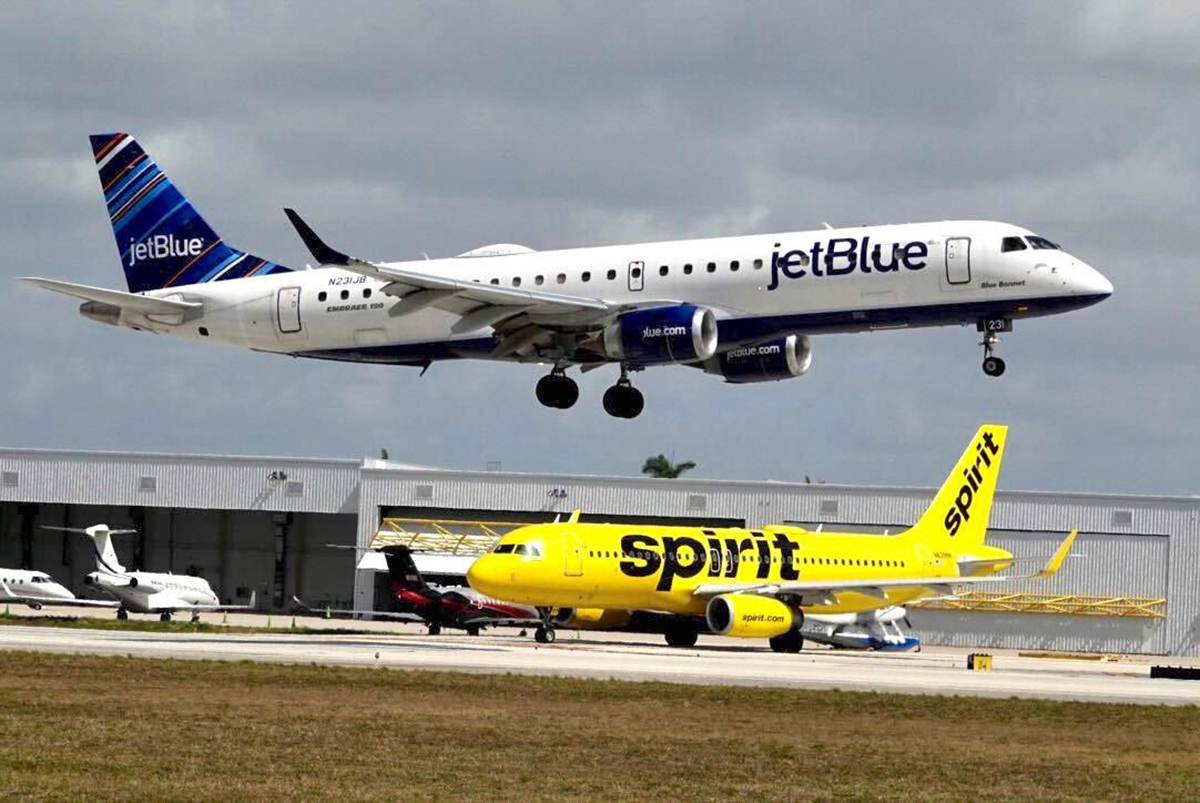 A JetBlue airliner lands at Fort Lauderdale Hollywood International Airport on Monday, April 25, 2022. An airline formed two years ago between American Airlines and JetBlue will be to an antitrust test in a Boston courtroom.