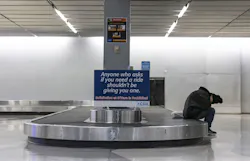 A homeless person sleeps inside Terminal 2 baggage claim on Jan. 19, 2023, at O Hare International Airport. A homeless person sleeps inside Terminal 2 baggage claim on Jan. 19, 2023, at O Hare International Airport.