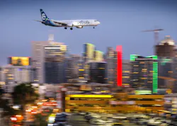 An Alaska Airlines Boeing 737 passes downtown San Diego moments before arriving at San Diego International Airport, May 7, 2018. An Alaska Airlines Boeing 737 passes downtown San Diego moments before arriving at San Diego International Airport, May 7, 2018.
