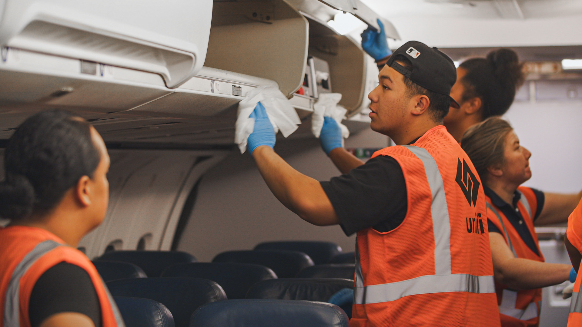 Touchpoints are cleaned and sanitized with a pre-saturated wipe.