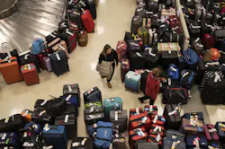 Madison Hranka, of Chicago, searches for her luggage among the hundreds of bags separated from their owners by major Southwest Airlines service interruptions at Midway Airport on Dec. 27, 2022, in Chicago. Madison Hranka, of Chicago, searches for her luggage among the hundreds of bags separated from their owners by major Southwest Airlines service interruptions at Midway Airport on Dec. 27, 2022, in Chicago.