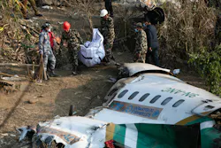 Nepal army, police and rescuers recover the body of a victim who died in a Yeti Airlines plane crash in Pokhara, Monday, Jan. 16, 2023. Nepal army, police and rescuers recover the body of a victim who died in a Yeti Airlines plane crash in Pokhara, Monday, Jan. 16, 2023.