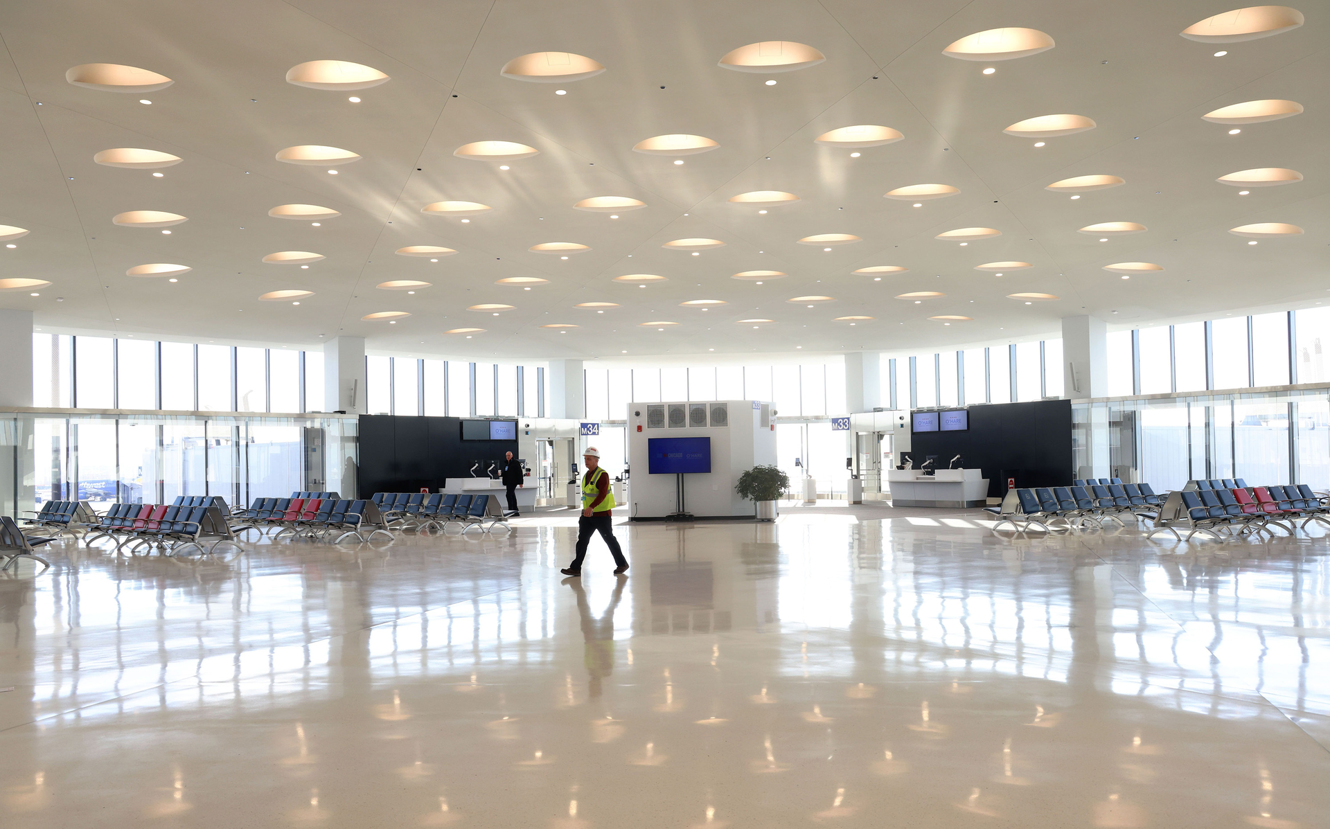 Dan Buchman walks through the newly expanded Terminal 5 at O'Hare International Airport on Jan. 31, 2023. The expansion includes 350,000 square feet of vaulted ceilings, natural light, and floor-to-ceiling high-performance glass offering an expansive view of the airfield.