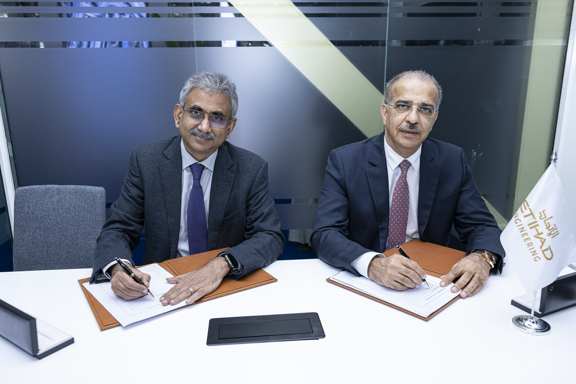 Venketrama Raja, chairman, Ramco Systems with Abdul Khaliq Saeed, CEO, Etihad Airways Engineering, during the signing ceremony at the 2023 MRO Middle East, Dubai.