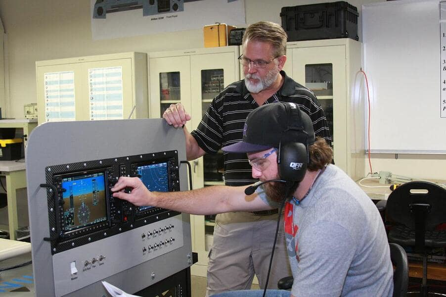 Professor Neil Fulbright, director of Avionics & Cybertechnology at Embry-Riddle&rsquo;s Daytona Beach Campus, works with an aviation line maintenance student in the Avionics Laboratory.