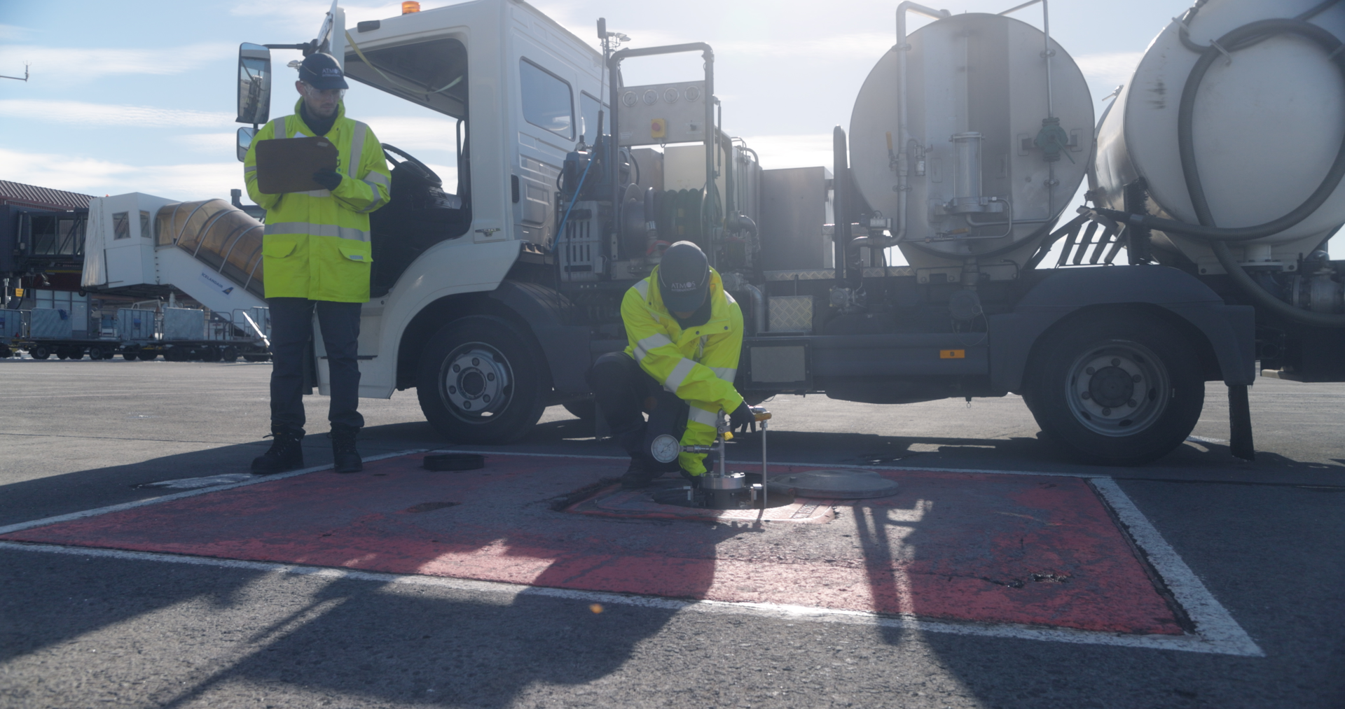 Hydrant operator staff completing a pit valve integrity test using a coupler