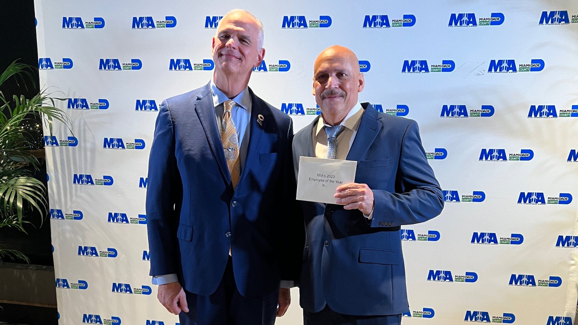 MIA Director Ralph Cutie and Employee of the Year Roberto Mayol