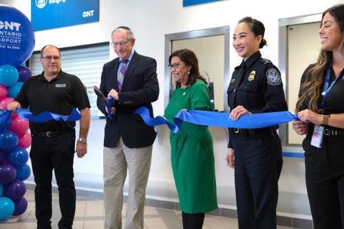 OIAA Commissioner Curt Hagman (second from left), OIAA Board President Alan Wapner (center left), Congresswoman Norma Torres (center right) and Cheryl M. Davies, CBP Director of Field Operations, cut the ribbon to ONT's new Global Entry Enrollment Center.