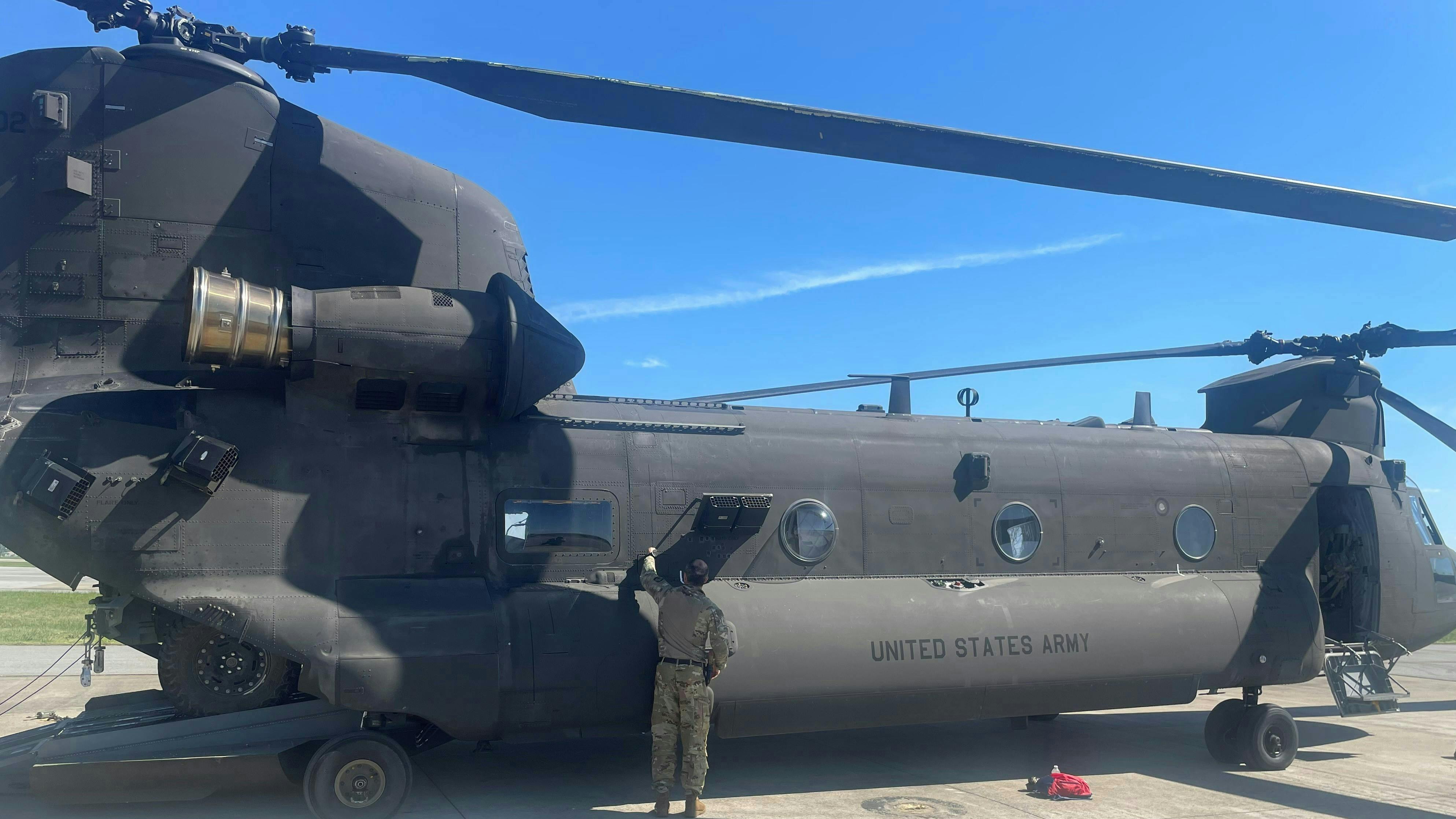A 101st Combat Aviation Brigade Flight Engineer conducts pre-flight checks of the Chinook CH-47F Block II.