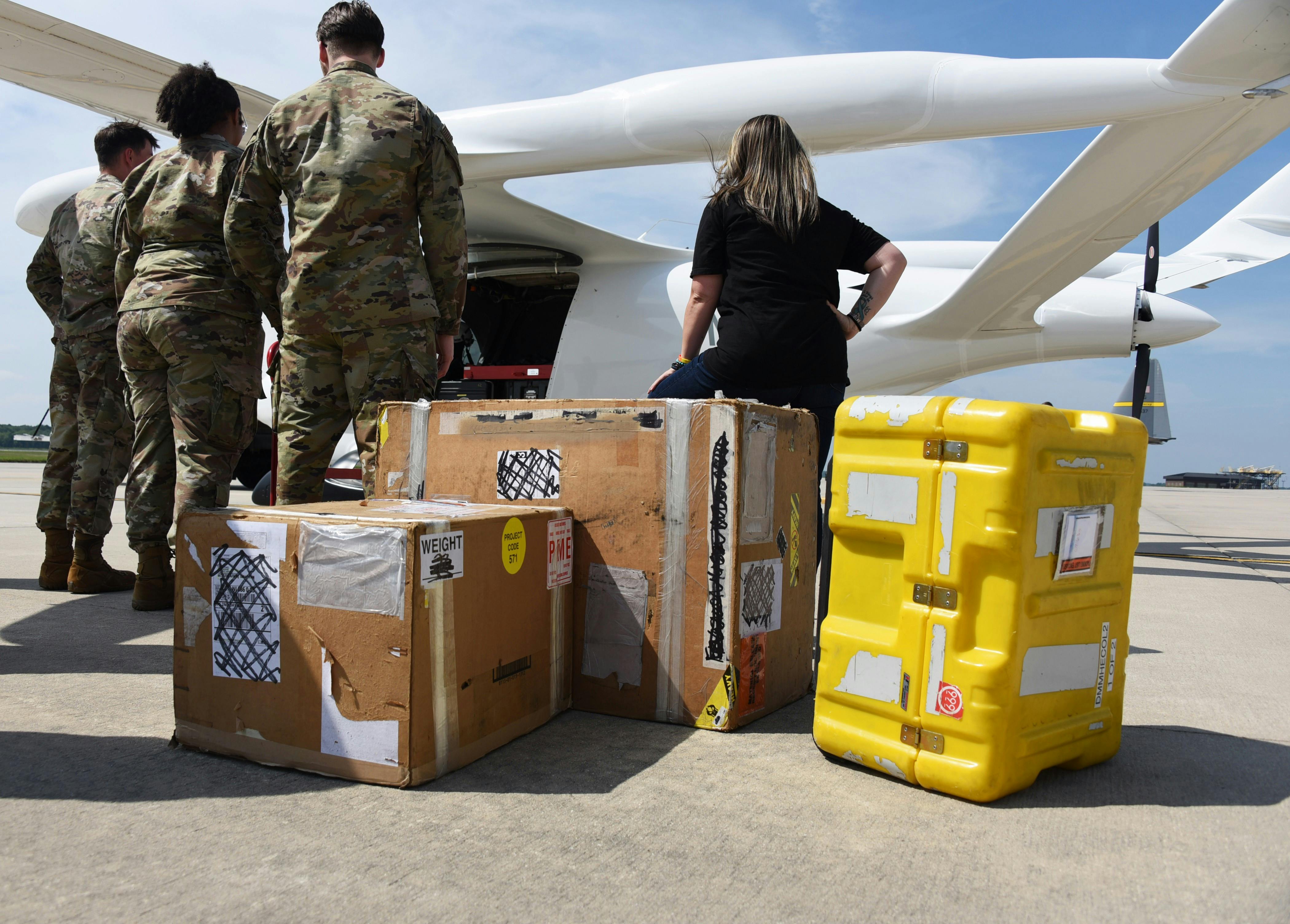 Alyxandra Scalone, 305th Maintenance Squadron Production Controller (right), and her Precision Measurement Equipment Laboratory team prepare to load cargo on BETA Technologies&rsquo; prototype, ALIA CTOL, a battery-powered fixed-wing aircraft at Joint Base McGuire-Dix-Lakehurst, N.J., July 9, 2024. This is the first demonstration of the aircraft&rsquo;s cargo capabilities. BETA partnered with AFWERX Agility Prime to test the capabilities of moving cargo between bases in a safer, cleaner, and more cost-effective way.