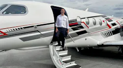 A man in business attire stepping out of a jet plane onto a staircase A man in business attire stepping out of a jet plane onto a staircase