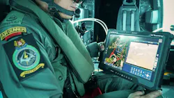 An air crew member in an Air Gunner uniform holding a tablet that shows maps and data An air crew member in an Air Gunner uniform holding a tablet that shows maps and data