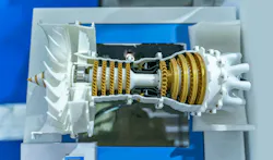 A white and gold airplane engine that has been 3D printed A white and gold airplane engine that has been 3D printed