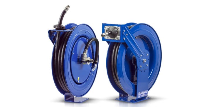 Two blue metal reels holding black hoses