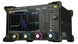 A large black piece of equipment with a screen showing a line graph and various knobs and buttons A large black piece of equipment with a screen showing a line graph and various knobs and buttons