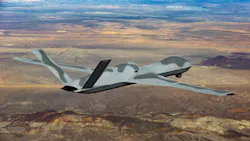 An aircraft with a camouflage-like pattern painted on it flying over a desert An aircraft with a camouflage-like pattern painted on it flying over a desert