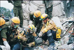 Fairfax County and Israeli firefighters use a search camera to hunt for victims in the Ufundi Building. Fairfax County and Israeli firefighters use a search camera to hunt for victims in the Ufundi Building.