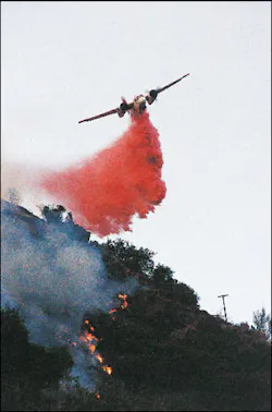 Fixed-wing aircraft joined in the attack on the fire. Here, a California Department of Forestry & Fire Protection (CDF) S-2 drops retardant on the fire line near the end of daylight on the first day of the incident. Fixed-wing aircraft joined in the attack on the fire. Here, a California Department of Forestry & Fire Protection (CDF) S-2 drops retardant on the fire line near the end of daylight on the first day of the incident.