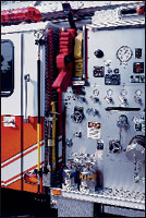 It's the little things that count. Note how space was allocated for two water extinguishers, a trash hook and a pair of irons, all in this one area. The proper position of hand tools makes the job on the fireground safer and reduces the risk of serious injury, as may be the case if these tools were stored inside the cab when an accident occurred.