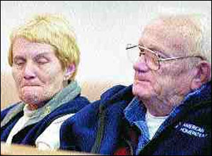 Alan Baird II, right, reacts as his son Alan Baird III appears in court.