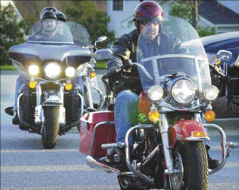 Jim Collins, founder of the Maryland chapter of the Red Knights, leads a group of fellow riders out of the