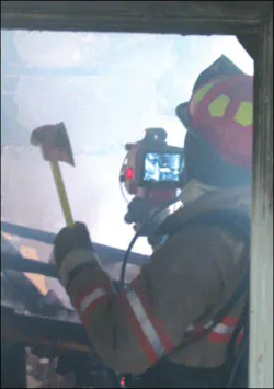 A thermal imager is assisting firefighters in overhaul by identifying hot spots. A thermal imager is assisting firefighters in overhaul by identifying hot spots.