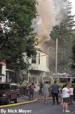 Smoke pours from the structure Sunday as firefighters work to contain the blaze in Cressona.