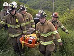 Firefighters carry an injured woman up the side of the gorge at Plotter Kill Nature Preserve Firefighters carry an injured woman up the side of the gorge at Plotter Kill Nature Preserve