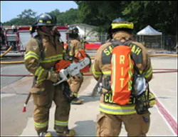 Assigned RIT personnel prepare to cut security bars to establish a secondary means of egress of interior crews. Assigned RIT personnel prepare to cut security bars to establish a secondary means of egress of interior crews.