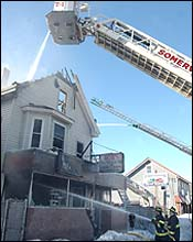 An early morning fire destroys businesses and residences at 504 Somerville Ave.