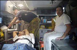 Seen through the window of an emergency service vehicle, a Los Angeles Fire Department paramedic, rear, attends to two building painters Thursday, March 3, 2005, in downtown Los Angeles. Firefighters broke a window to rescue the painters who spent about 40 minutes dangling from a 10-story building after their scaffolding collapsed beneath them. Neither worker was injured. Seen through the window of an emergency service vehicle, a Los Angeles Fire Department paramedic, rear, attends to two building painters Thursday, March 3, 2005, in downtown Los Angeles. Firefighters broke a window to rescue the painters who spent about 40 minutes dangling from a 10-story building after their scaffolding collapsed beneath them. Neither worker was injured.
