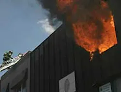 INFERNO: Firefighters scramble to contain an apartment fire in Brooklyn yesterday. The fire was started by a tenant's votive candle that pore Jesus' picture. INFERNO: Firefighters scramble to contain an apartment fire in Brooklyn yesterday. The fire was started by a tenant's votive candle that pore Jesus' picture.