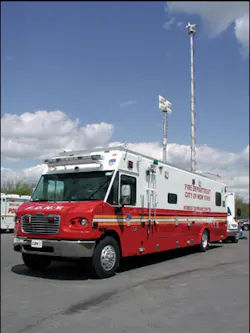 Telescoping masts on the FDNY unit provide a platform for a variety of devices. The communications area is separated from the command/conference area by sliding doors. Telescoping masts on the FDNY unit provide a platform for a variety of devices. The communications area is separated from the command/conference area by sliding doors.