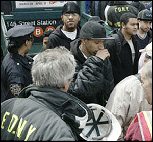 COMING UP FOR AIR: Riders make their way out of the 145th Street subway station after being evacuated from stuck B and D trains. A conductor kept many of them in the dark by not explaining why the train stopped.
