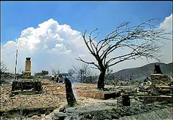 The remains of a home smolder in a section of the Cave Creek Complex Fire, Thursday, June 23, 2005, near Carefree, Ariz. The windblown Arizona blaze burned at least 30,000 acres and forced the evacuation of numerous homes. The remains of a home smolder in a section of the Cave Creek Complex Fire, Thursday, June 23, 2005, near Carefree, Ariz. The windblown Arizona blaze burned at least 30,000 acres and forced the evacuation of numerous homes.