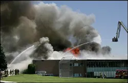 Firefighters spray water on Wasatch Junior High School as it burns in Salt Lake City, Monday, July 11, 2005. A six-alarm fire Monday destroyed the school, leaving officials scrambling to place 850 students for the fall term that starts in less than seven weeks. Firefighters spray water on Wasatch Junior High School as it burns in Salt Lake City, Monday, July 11, 2005. A six-alarm fire Monday destroyed the school, leaving officials scrambling to place 850 students for the fall term that starts in less than seven weeks.