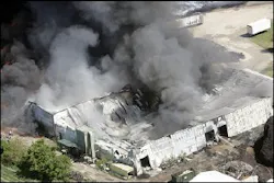 Smoke billows from building at fire at Watertown Tire Recyclers, Tuesday, July 19, 2005, in Watertown, Wis. Smoke billows from building at fire at Watertown Tire Recyclers, Tuesday, July 19, 2005, in Watertown, Wis.