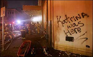 Firefighters from New Orleans and other cities around the country work a fire at an office building in New Orleans on Thursday, Sept. 15, 2005. With electrical systems soaked, and gas leaks a possibility, fire officials are answering calls in force as the city attempts to return to a sense of normalcy.