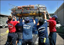 From left; Phoenix firefighter recruit Rory Costello, Capt. Tom Henry, Capt. Gilbert Cardenas and recruit Todd Yonker hoist rescue baskets atop a pallet of rescue supplies in this Tuesday, Aug. 30, 2005, file photo at the Phoenix Firefighter Training Academy in Phoenix, prior to leaving for New Orleans. Phoenix Fire department, which sent their search and rescue team to assist in the aftermath of Hurricanes Katrina and Rita, has had it's search and rescue teams suspended from operations by FEMA becasue it sent armed police officers to protect the firefighters during their deployement to the Gulf Coast. At issue is a rule in FEMA's Code of Conduct that prohibits Urban Search and Rescue teams from having firearms. From left; Phoenix firefighter recruit Rory Costello, Capt. Tom Henry, Capt. Gilbert Cardenas and recruit Todd Yonker hoist rescue baskets atop a pallet of rescue supplies in this Tuesday, Aug. 30, 2005, file photo at the Phoenix Firefighter Training Academy in Phoenix, prior to leaving for New Orleans. Phoenix Fire department, which sent their search and rescue team to assist in the aftermath of Hurricanes Katrina and Rita, has had it's search and rescue teams suspended from operations by FEMA becasue it sent armed police officers to protect the firefighters during their deployement to the Gulf Coast. At issue is a rule in FEMA's Code of Conduct that prohibits Urban Search and Rescue teams from having firearms.