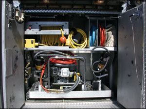 The storage of hydraulic rescue tools and electric cable reels can be combined in relatively small areas, when required. This unit is operated by the Waldorf, MD, Fire Department.