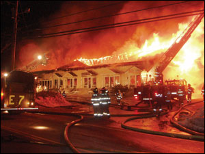 Tilton-Northfield Ladder 1 and multiple street guns protect the exposure 30 feet from division D.
