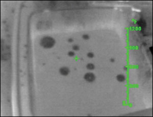 Materials that float or stay on the surface beneath them can be identified and tracked with a thermal imager. Here, oil on water is easy to identify by the temperature differences. Note that materials miscible with water will not be traceable with the TI.