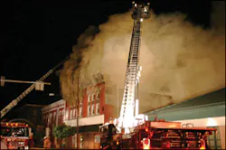 Osceola Mills Engine 22-2 supplies Madera Tower 25 on Presqueisle Street (side D) as its crew advances attack lines to the second floor. At left is Alpha Tower 5-16, which operates its ladder pipe, supplied by Houtzdale Engine 23-1. Osceola Mills Engine 22-2 supplies Madera Tower 25 on Presqueisle Street (side D) as its crew advances attack lines to the second floor. At left is Alpha Tower 5-16, which operates its ladder pipe, supplied by Houtzdale Engine 23-1.
