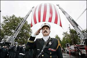 North Hudson Regional Fire and Rescue Battalion Chief Jack Farrington leads a salute for firefighter Vincent Neglia outside Our Lady of Fatima Church following Neglia's funeral Sept. 14.