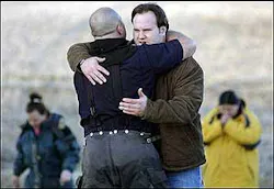 House resident Eddy Miller hugs a firefighter who had been working on the blaze. House resident Eddy Miller hugs a firefighter who had been working on the blaze.