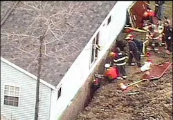 Rescue crews work to free a construction worker trapped in a trench in Summit County. Rescue crews work to free a construction worker trapped in a trench in Summit County.