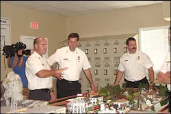 Charleston Chief Rusty Thomas, center, and Assistant Chief Robert O'Donald listen to Montgomery County Assistant Chief Greg DeHaven, far left, during training. Charleston Chief Rusty Thomas, center, and Assistant Chief Robert O'Donald listen to Montgomery County Assistant Chief Greg DeHaven, far left, during training.