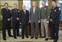 Richmond Firefighter David Loving, far right, is accompanied by, from left: Officer Kevin Howland of Sacramento; Officer Todd Myers of West Hartford, Conn.; Attorney General Mukasey; President Bush and Sgt. Kirk Van Orsdel of Hemet, Calif. Richmond Firefighter David Loving, far right, is accompanied by, from left: Officer Kevin Howland of Sacramento; Officer Todd Myers of West Hartford, Conn.; Attorney General Mukasey; President Bush and Sgt. Kirk Van Orsdel of Hemet, Calif.